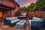 Walk out to a private hot tub and comfortable patio